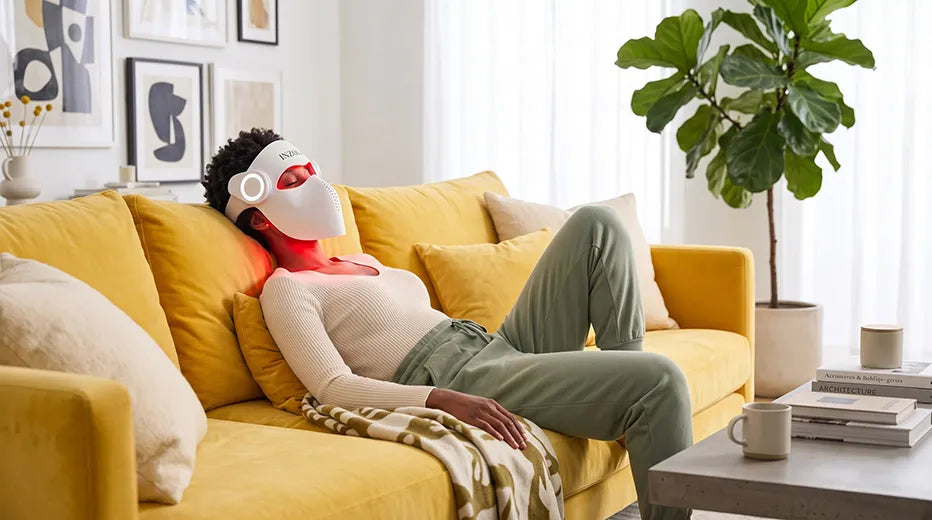 Woman wearing the cordless Inzoli face mask while reading at home